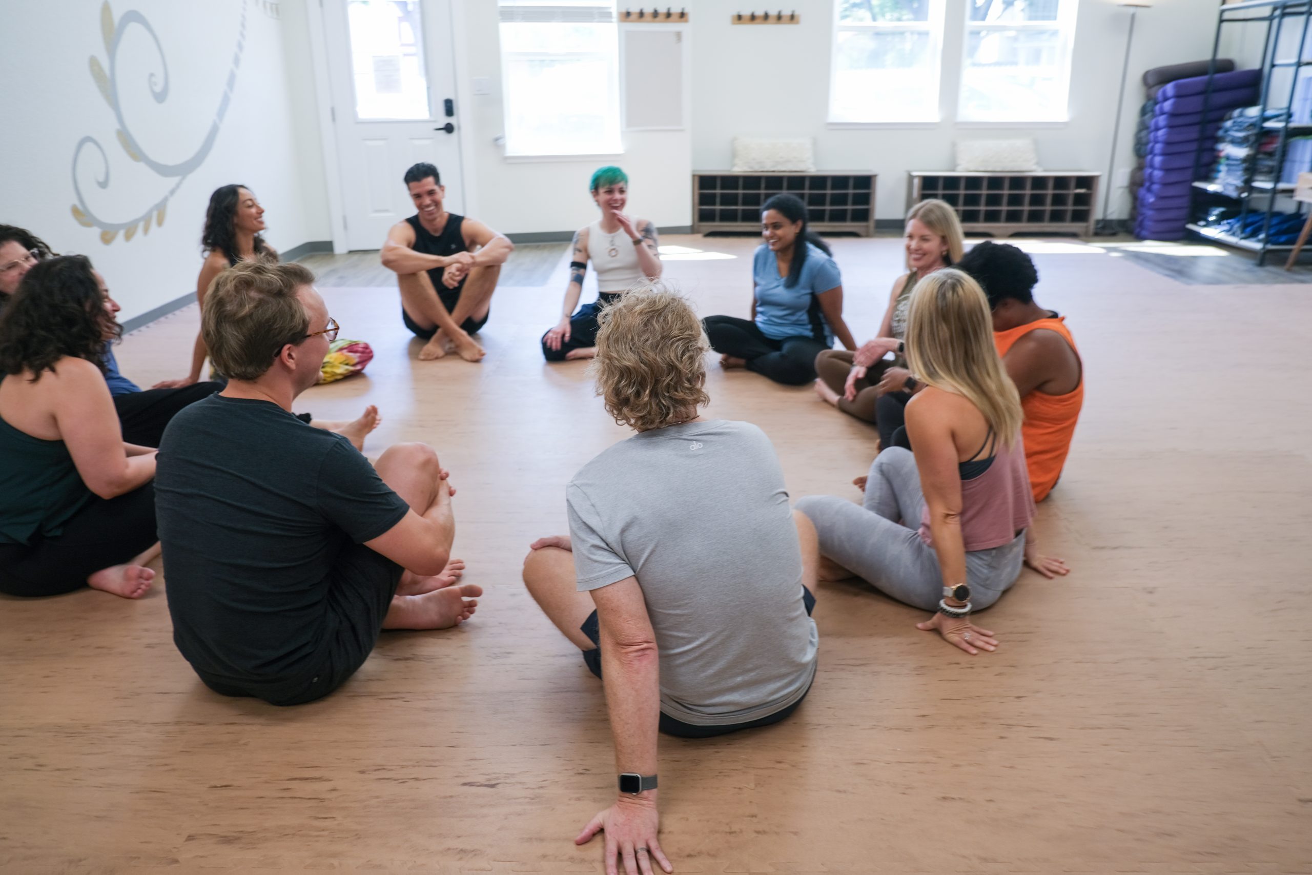 Yoga teachers sitting in a circle